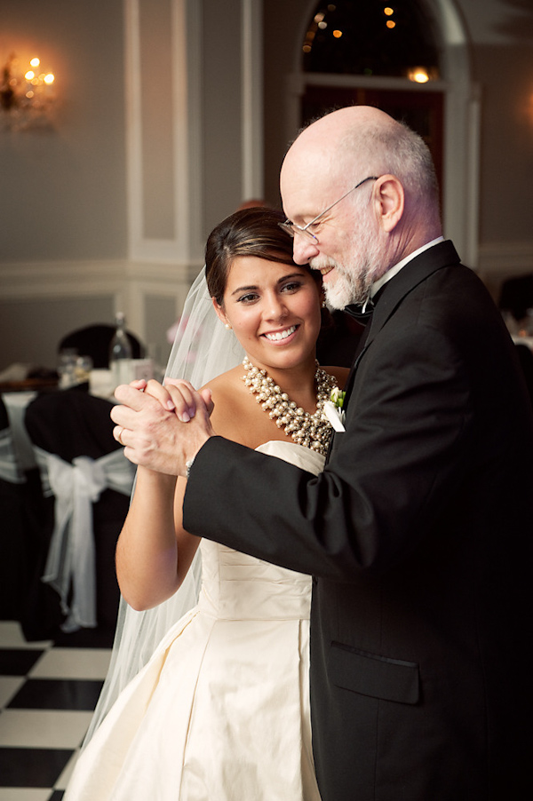 Bride and father of the bride dancing at reception - Bride is wearing white ball gown style dress, full length veil, and beaded necklace - photo by Houston based wedding photographer Adam Nyholt
